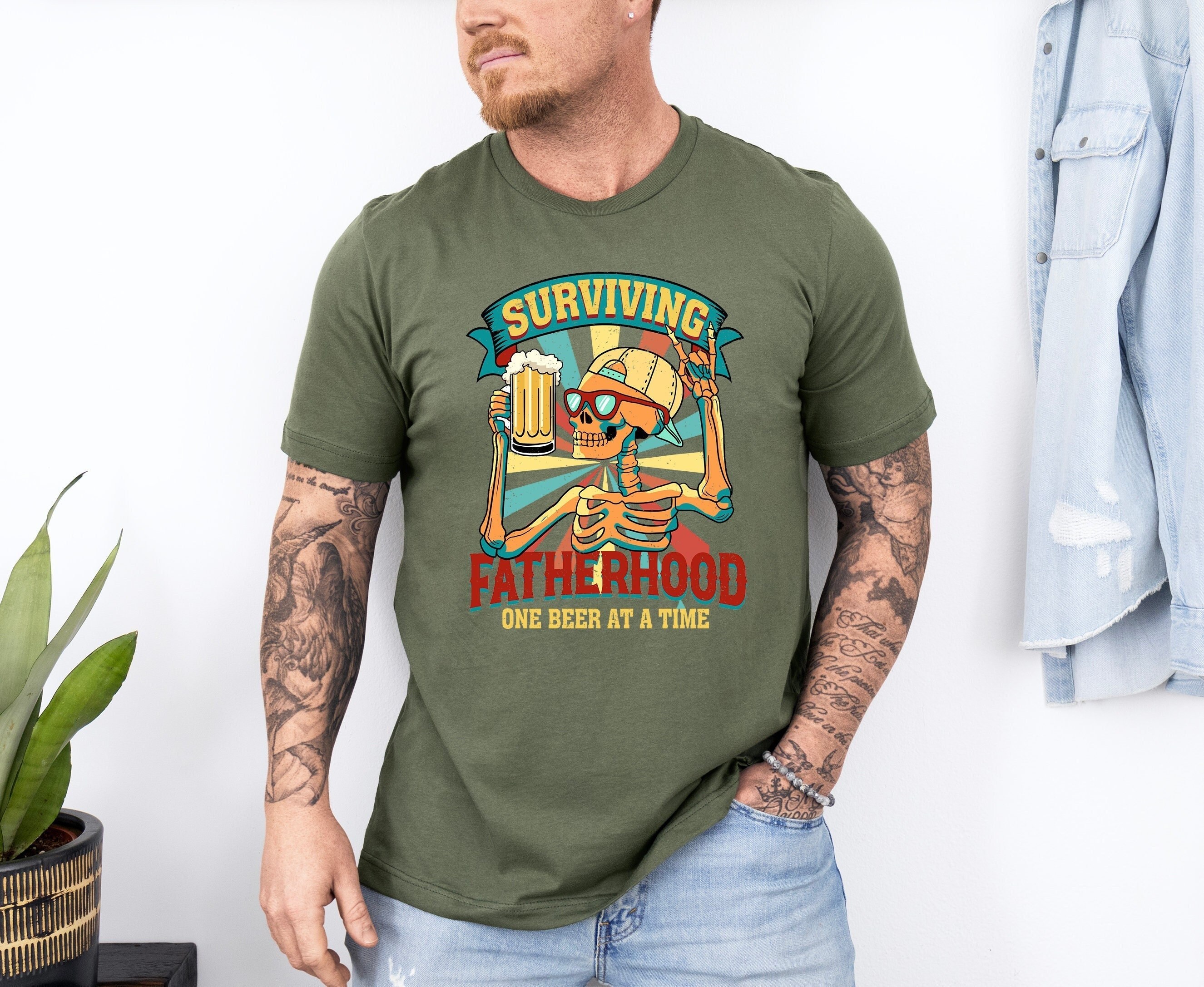 surviving fatherhood one beer at a time shirt retro dad life t shirt for beer lover dads fathers day gift t3sjk scaled